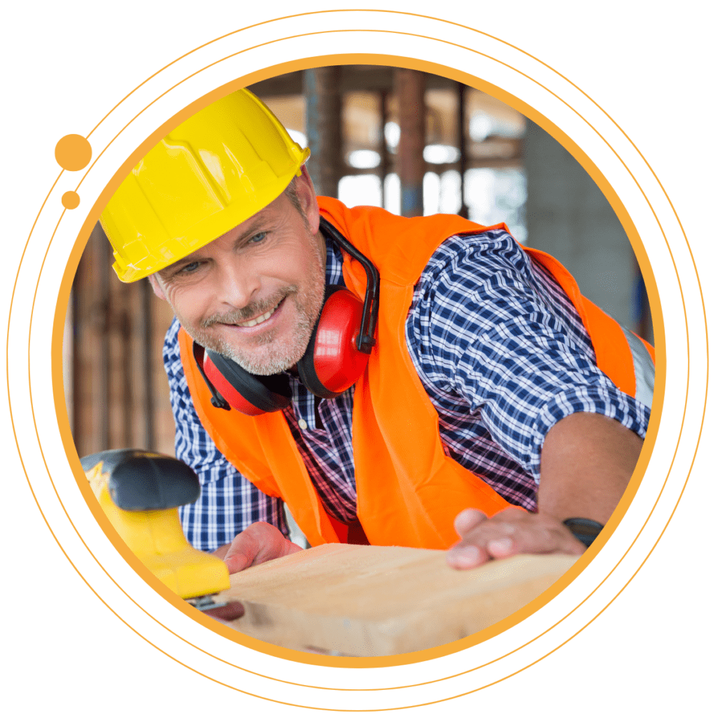 a construction worker milling wood