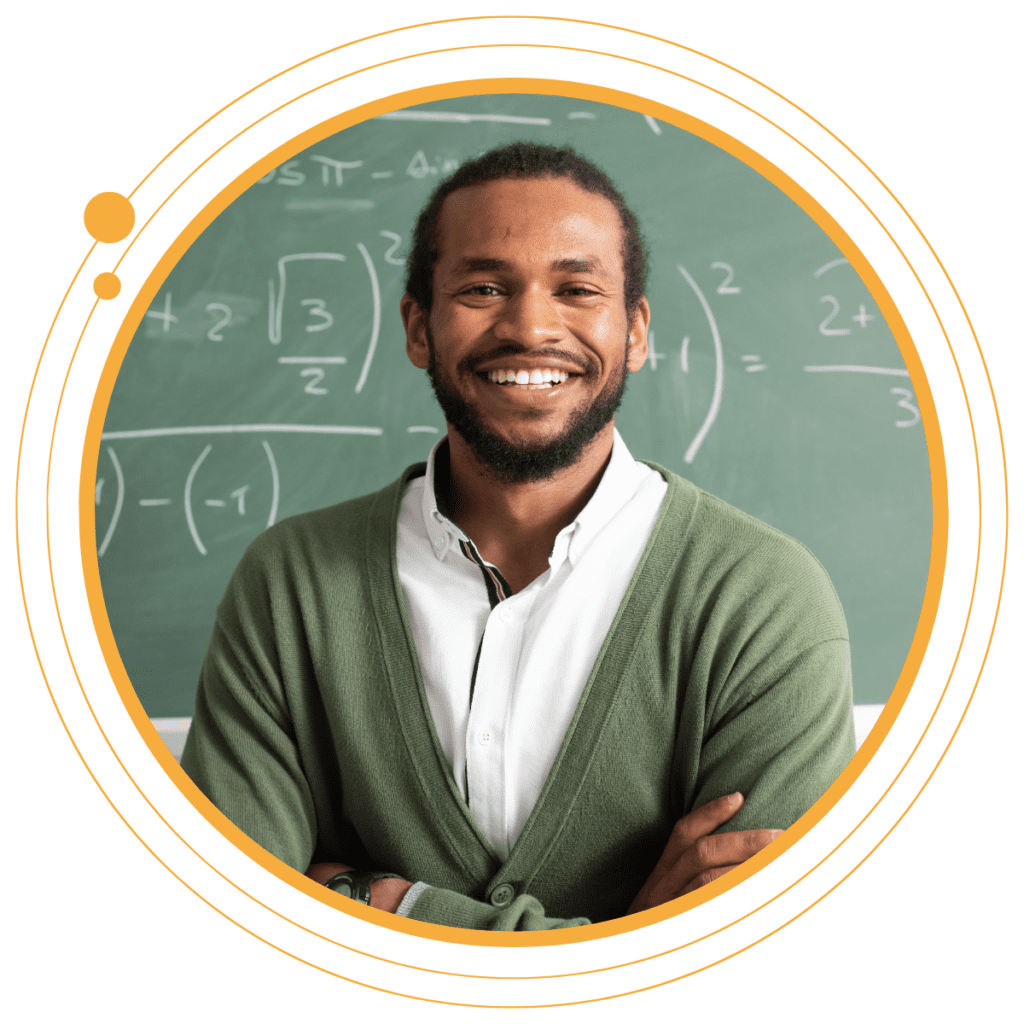 a teacher in front of a chalk board