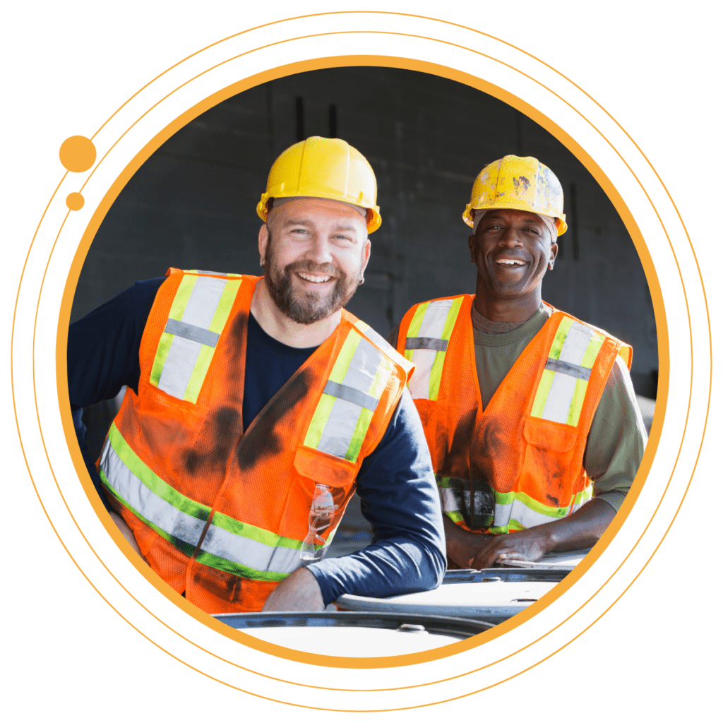 two construction workers smiling