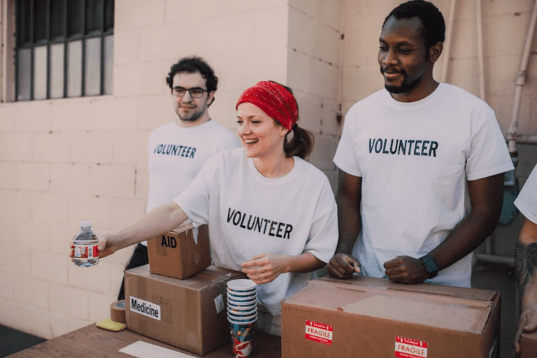 three people donating goods