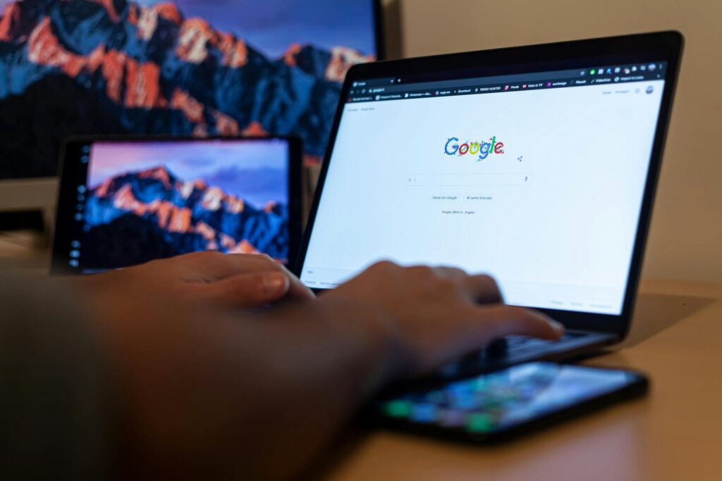 close-up of hands using a laptop
