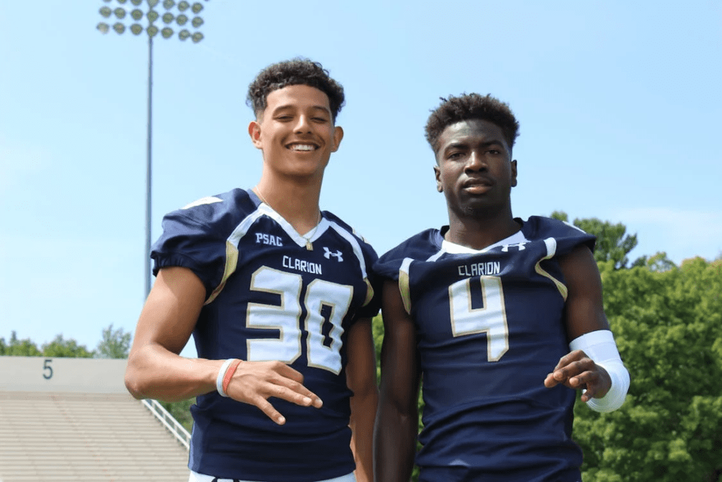 two men wearing american football uniform