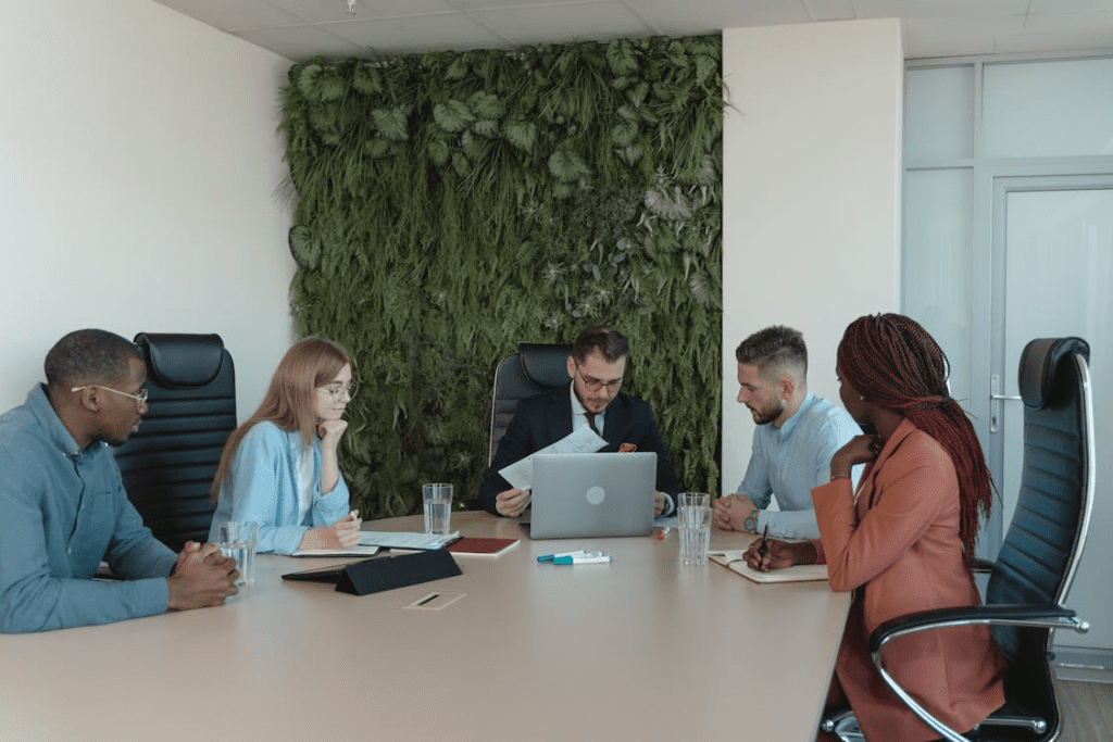 employees in the meeting room having a discussion